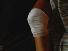 Evaluating Connective Tissue Recovery: BPC-157 or TB-500 vs KLOW Blend Injured knee with bandage, Photo by Alexey Demidov