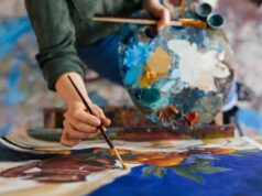 View of an artist painting with oil paints.