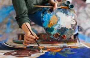 View of an artist painting with oil paints.