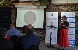 Kellye Stelling, Location Leader with Isaiah 117 House, delivereing an inspiring presentation.