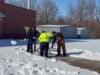 Public works employees helping clean off a walkway to LES during the winter weather event Lakeland experienced this past winter.
