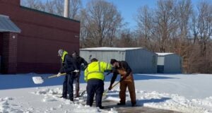 Public works employees helping clean off a walkway to LES during the winter weather event Lakeland experienced this past winter.